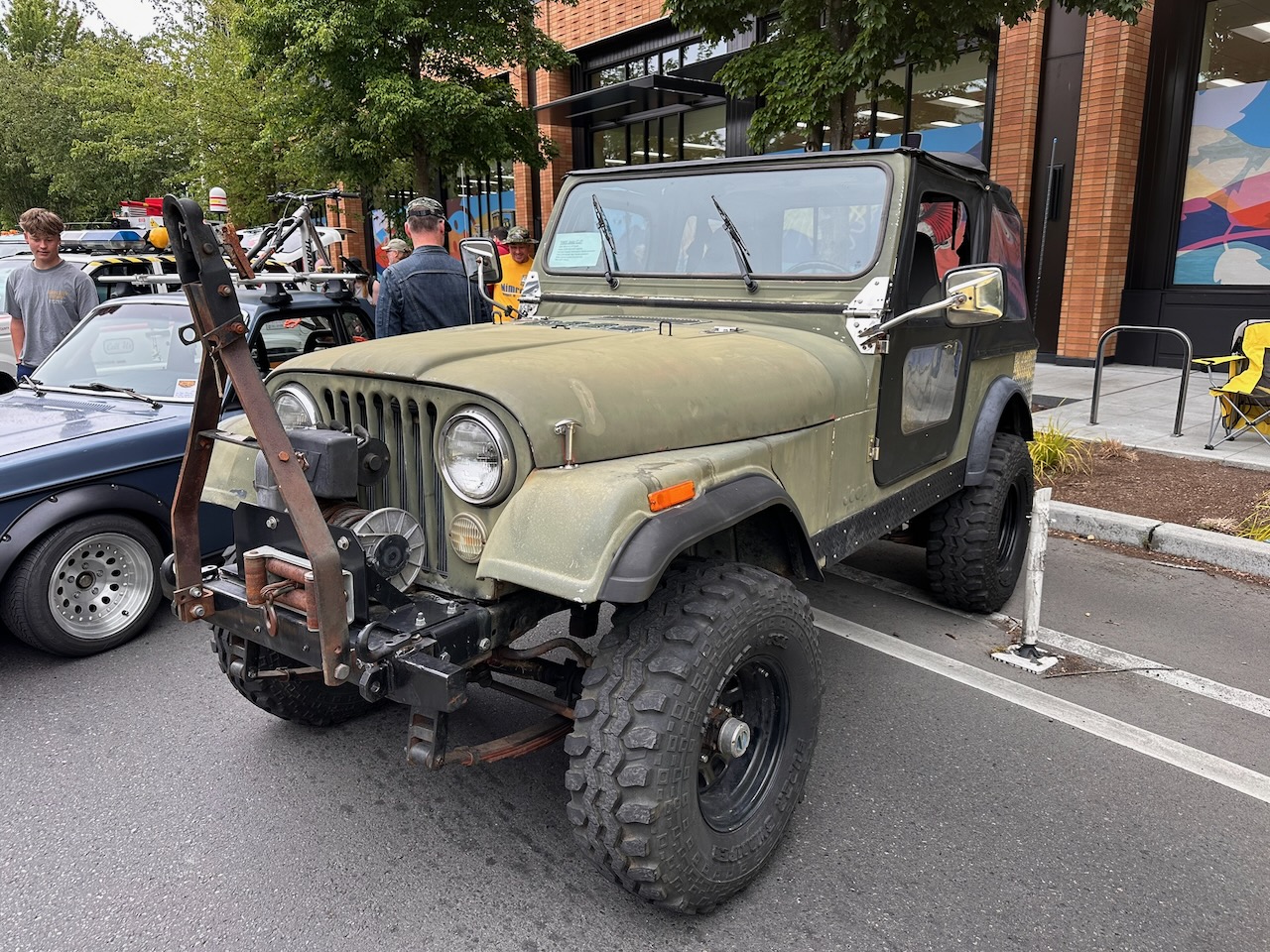 Army green CJ-5 at car show