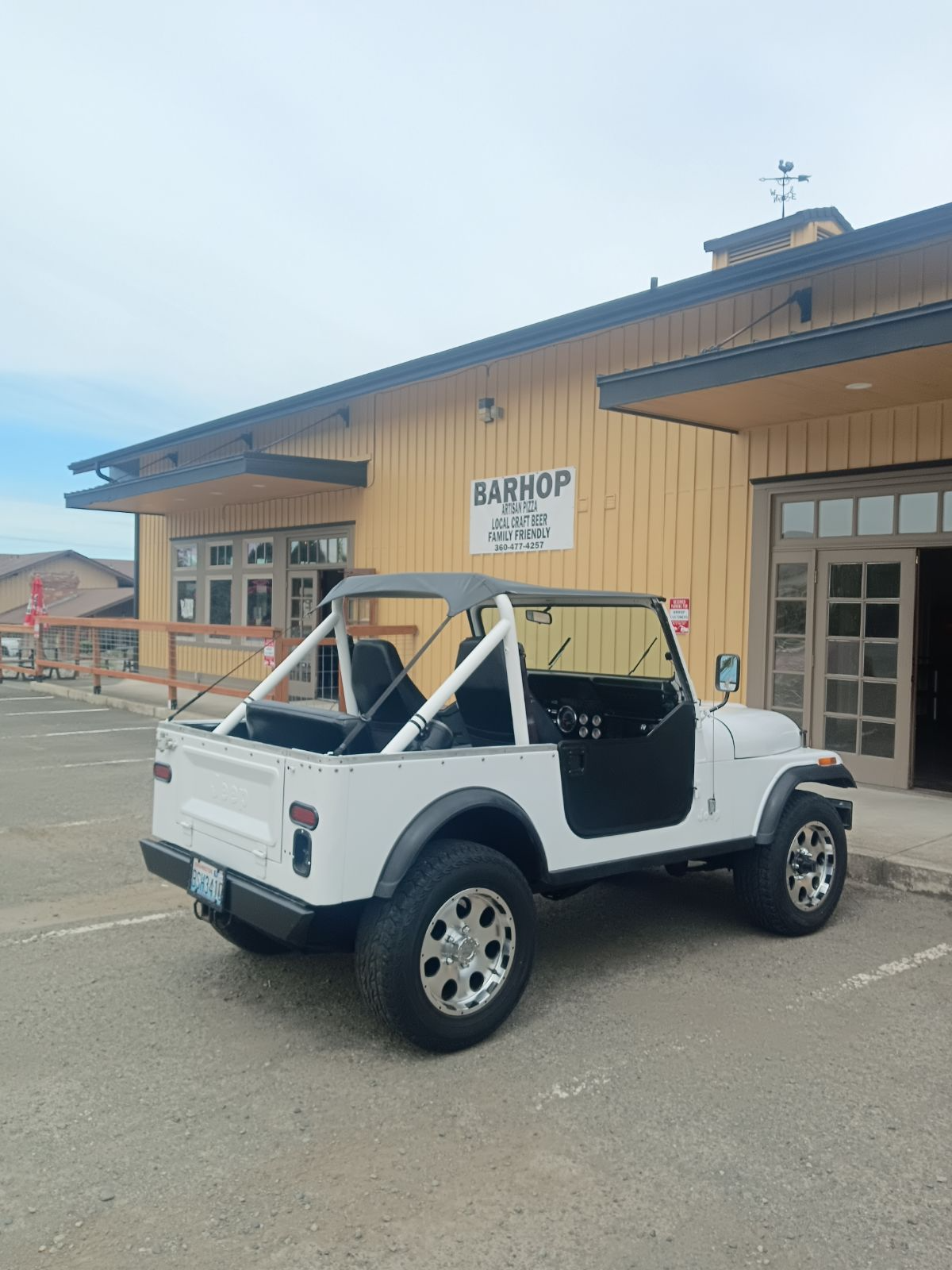 White CJ-7 rear three-quarter view